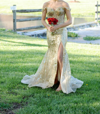 Gold sherri hill mermaid prom dress with slit size 4. Never altered / worn once