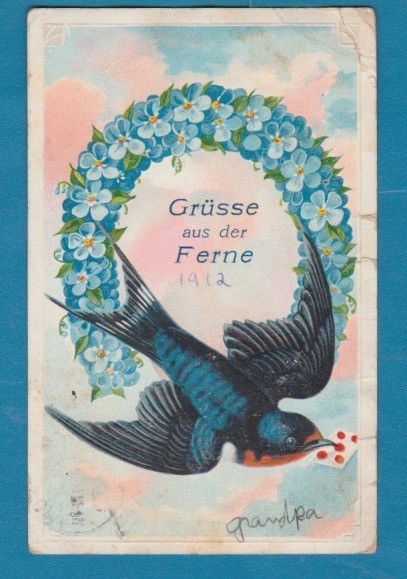 Greetings from afar embossed postcard/ large blue bird / blue flowered wreath/