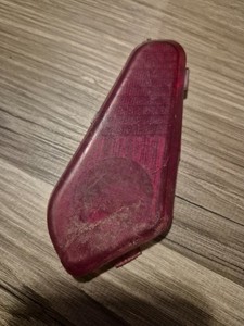 Small red reflector, some damage