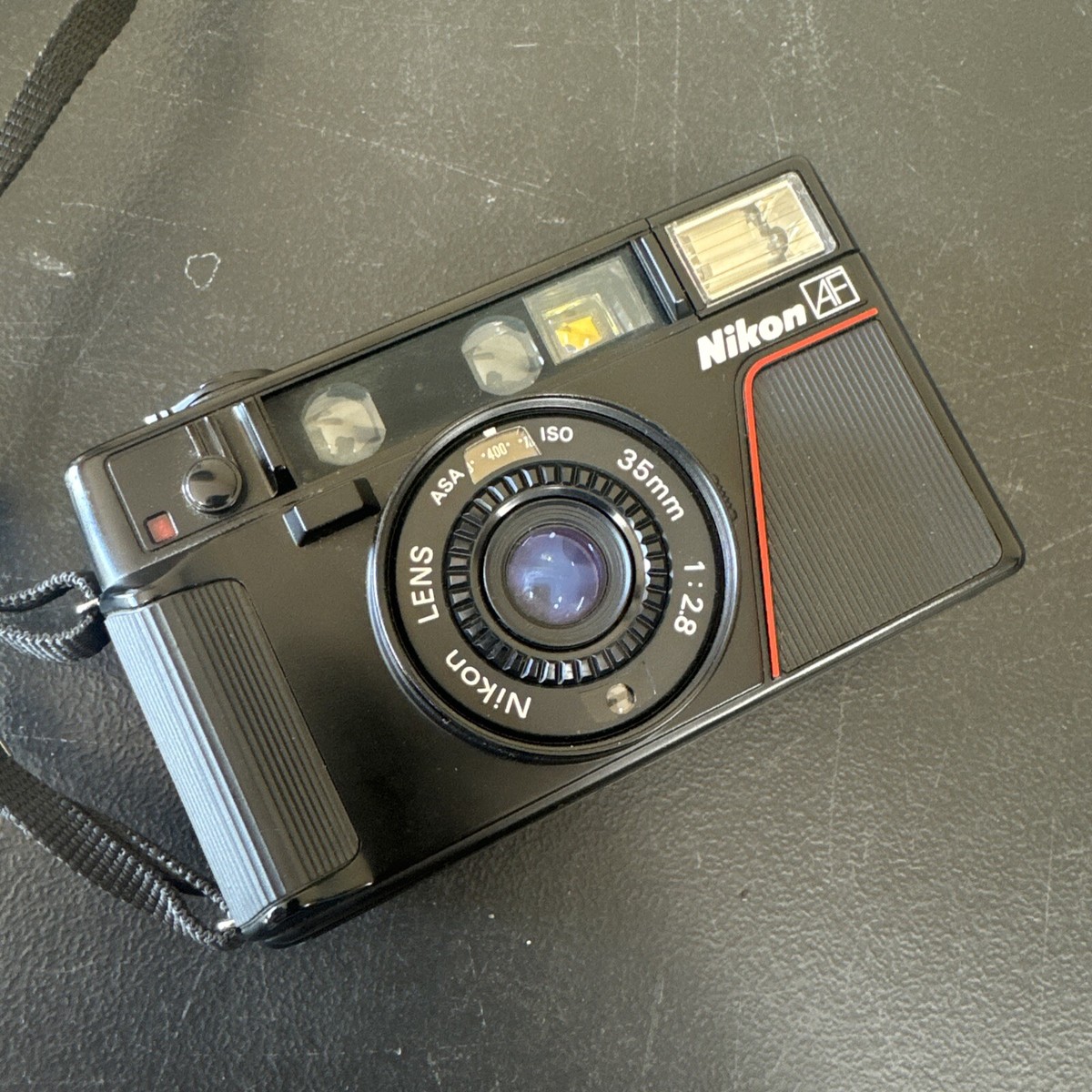 Nikon L35AF 35mm Point and Shoot Film Camera 1:2.8 Lens Fully Nikon L35AF 35mm Point and Shoot Film Camera 1:2.8 Lens Fully