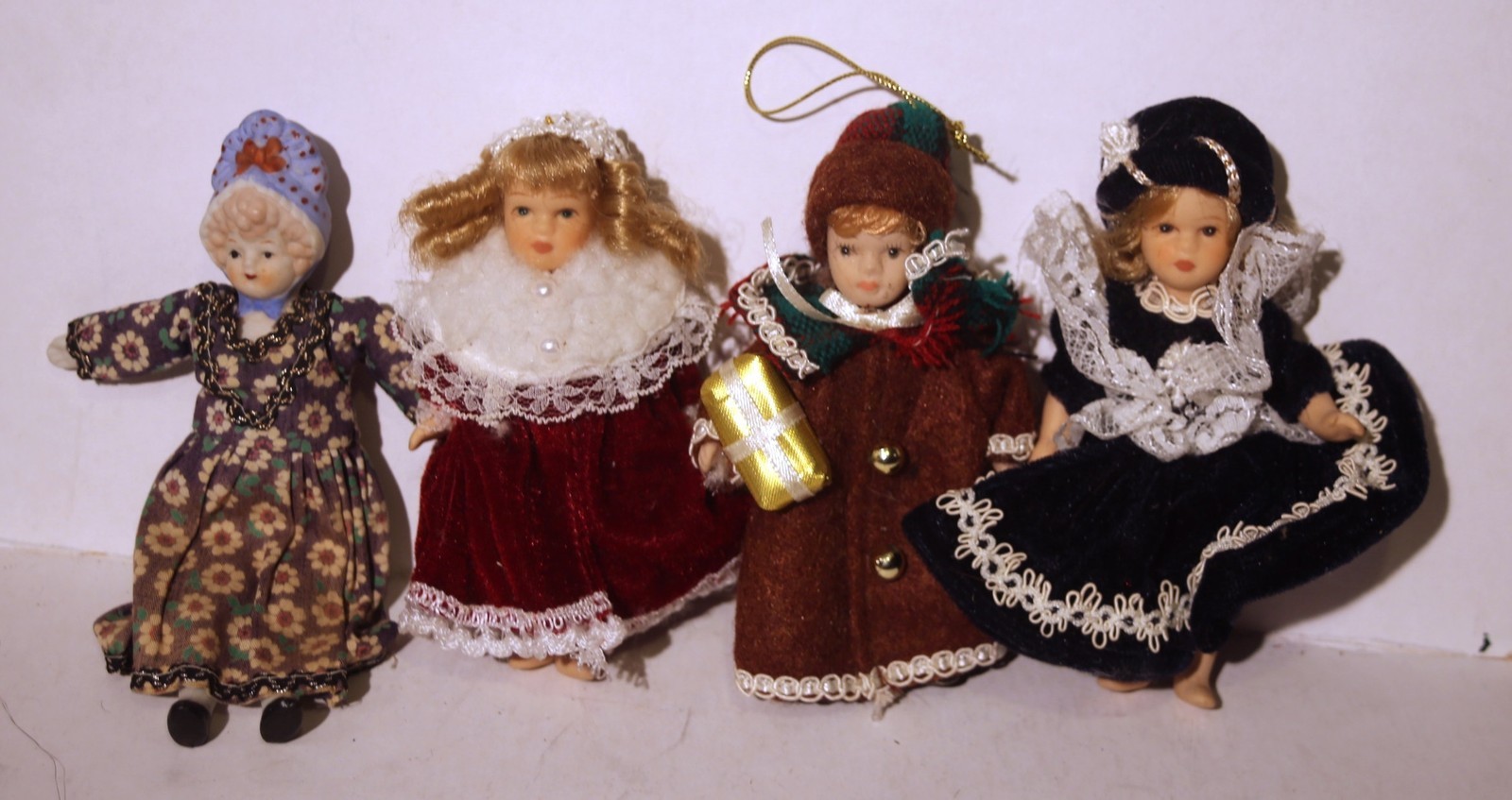 4 small bisque dolls, 5 inches