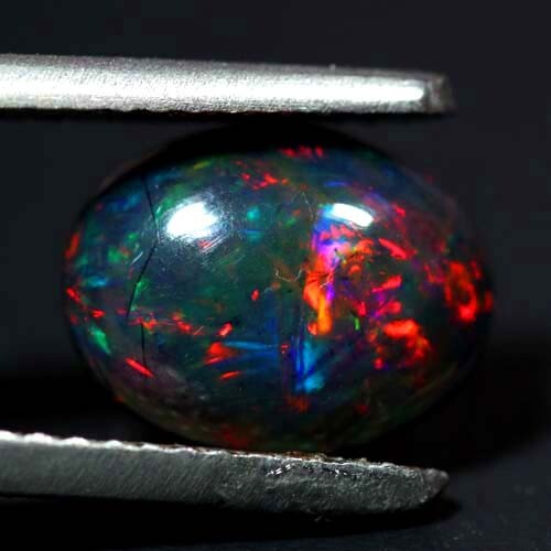 NATURAL AAA+ DAZZLING COLOR PLAY OVAL CABOCHAN ETHIOPIAN BLACK WELO OPAL 1.00CTS - Bild 2 von 3