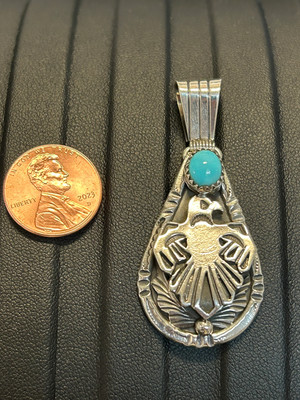 Navajo handcrafted sterling silver pendant with genuine turquoise stone. LZ306