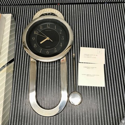 Vintage OverOcean Quartz Postmodern plastic gold wall clock with pendulum 1980s
