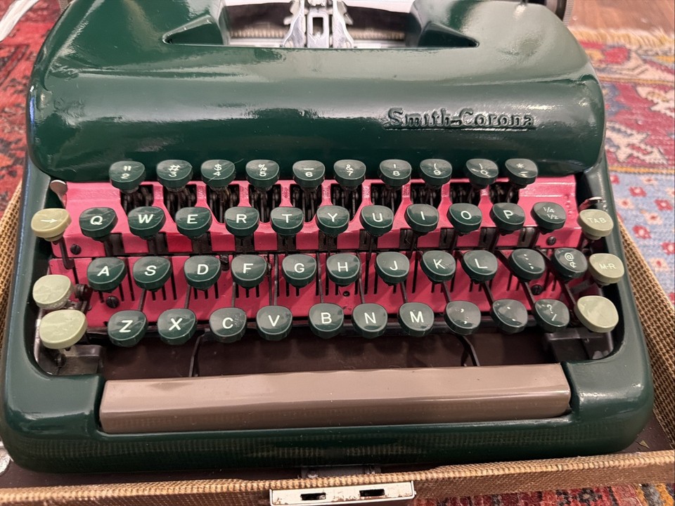 A professionally cleaned and serviced 1953 Smith Corona Sterling in Army Forest Green — rare military colorway, excellent condition, and ready to write.