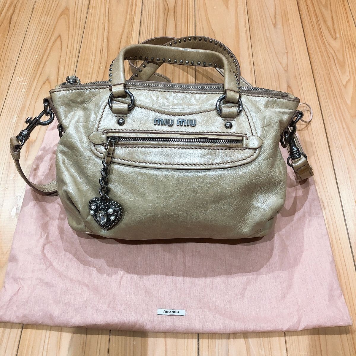 Miu Miu heart charm leather handbag with beige shoulder Miu Miu heart charm leather handbag with beige shoulder