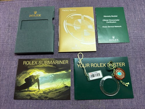 Rolex 2007 Submariner Accessories Set.Booklets;card hold;Tag;Bezel Ring.English
