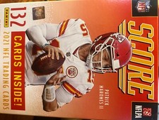 Assorted 2021 football cards: Prestige, Donruss Eiltes, Score, and Sage premier.