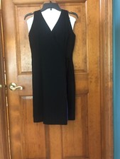 Black faux wrap dress fully lined in satiny periwinkle, sleeveless, knee length