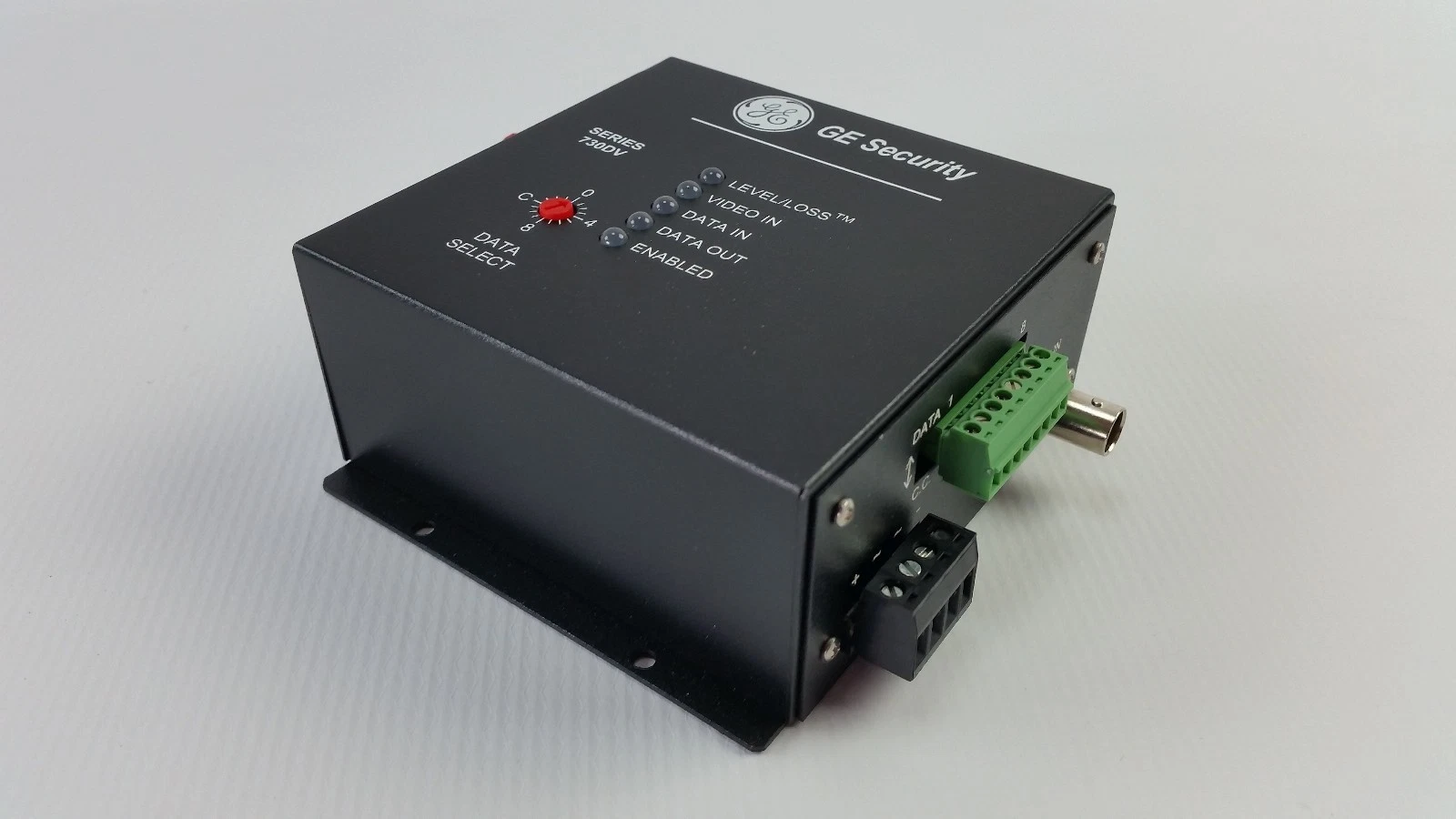 S730DVT-EST2 transmitter at an angle, showing the data terminal block and BNC video input