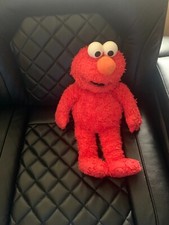 SESAME STREET ELMO;STUFFED WITH HUGS AND GOOD WISHES.2004 SESAME WORKSHOP.
