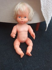 A 1970s Baby Alive doll in fair condition