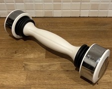 Shake Weight dumbbell, a specialized exercise tool designed for upper body