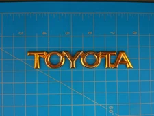 Toyota Gold Emblem Badge OEM 75447-AA010 Genuine Rear Trunk Nameplate Logo JDM