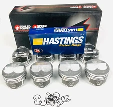 .275" Dome coated skirt Pistons Set of (8) and Matching moly rings 350 Chevy.