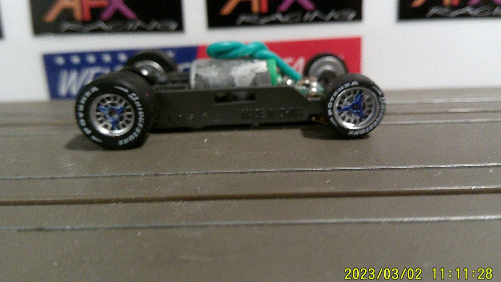 AFX Racing HO Scale Mega G+ 1.5 Narrow Chassis with Silver Rims Red Blue Spin Lett Wheels