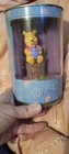 Winnie the Pooh 4" figurine w/ honey pot on tree stump in metal round tin Disney — photo 1