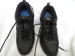 solid black new balance shoes