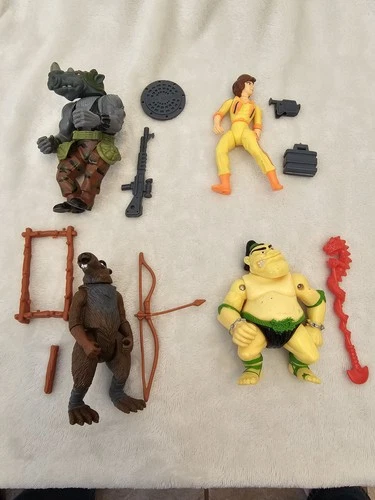 Vintage lot of 4 Teenage Mutant Ninja Turtle figures w/ Weapons Accessories
