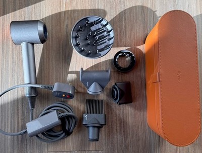 Dyson Supersonic Hair dryer nickel/copper with attachments and box. Great item!