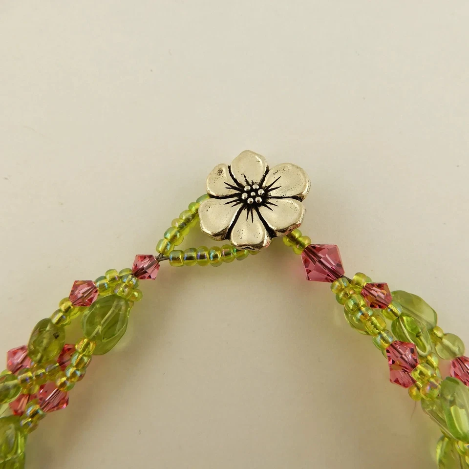 3 strand bracelet made w/ Swarovski, Peridot pink & green beads & flower clasp - Image 4 of 4