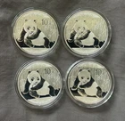 Lot of (4) 2015 SILVER PANDA 1 Oz.  .999 SILVER COINS -  10 Yuan - Light Toning