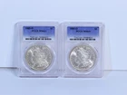 Lot Of 2: 1885-O PCGS MS 64+ Morgan Dollars $1