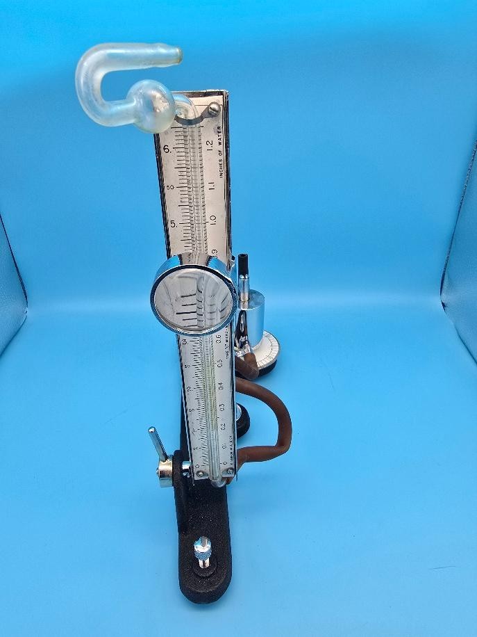 A genuinely rare Victorian-era micro-tonometer in its original wood case — the kind of scientific antique that stops visitors dead in their tracks.