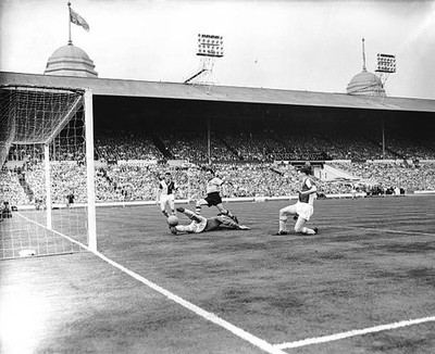 Blackburn Rovers Dave Whelan looks on as teammate Mick McGrath div- Old Photo