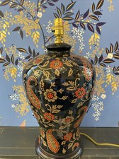 Image of Black Table lamp With Dark Gold And Red Flowers