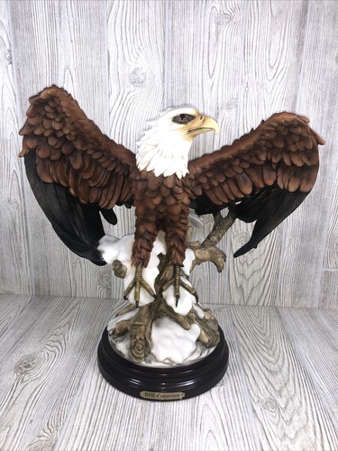BHE COLLECTION Eagle Statue Ready to Take Flight Perched On Snow & Logs Resin