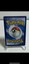 Fletchinder 028/195 Swsh12 holo card with silver disc, black/white design, and visible Pokémon logo.