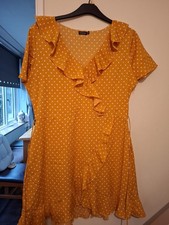 Used Yellow And White Poker Dot Size 18 Boohoo Dress. frill at front Tie Belt.