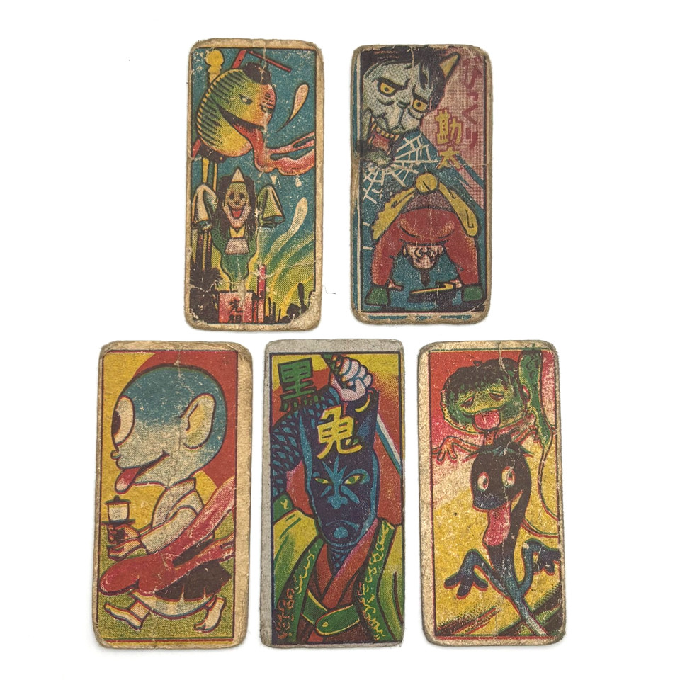 Genuine vintage Japanese Menko cards featuring hand-illustrated yokai demons — pocket-sized folk horror artifacts with serious wall-art or display potential.
