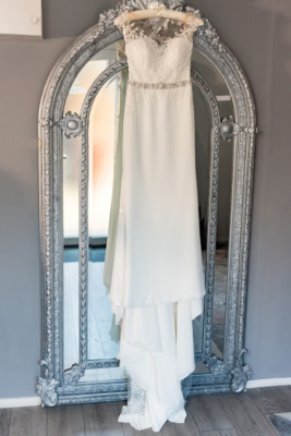 orange one sleeve homecoming dress Anna Halter Crepe Column Wedding Dress with Long Drapes | Bone and Grey  Bridal main image 1
