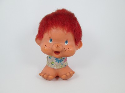 old doll with red hair