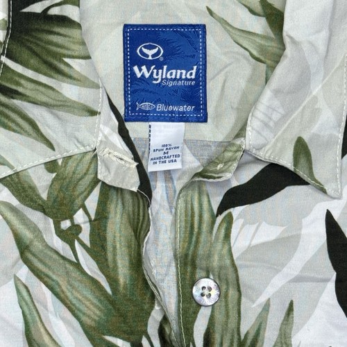 Light gray vintage Wyland AFTCO Bluewater men’s shirt with green leaf print and blue island label inside collar.