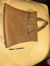 Bolso de mano de cuero marrón Hermès vintage con logotipo H perforado