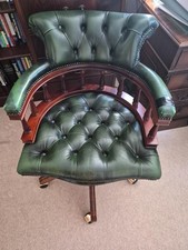 Traditional Chesterfield-style green leather swivel/captain’s desk
