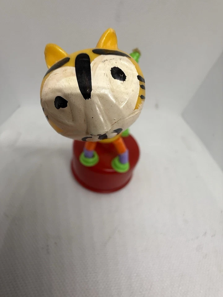 Juguete infantil vintage tigre empujar y jugar juguete plástico colapsable para niños Foto 4 de 4