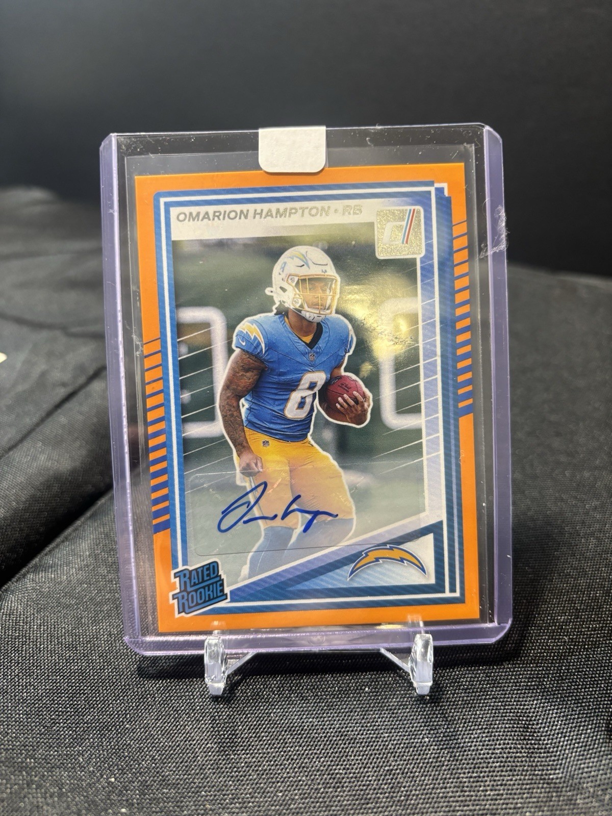 2025 Panini Donruss - Rated Rookie Omarion Hampton Orange Auto #303 RC SP