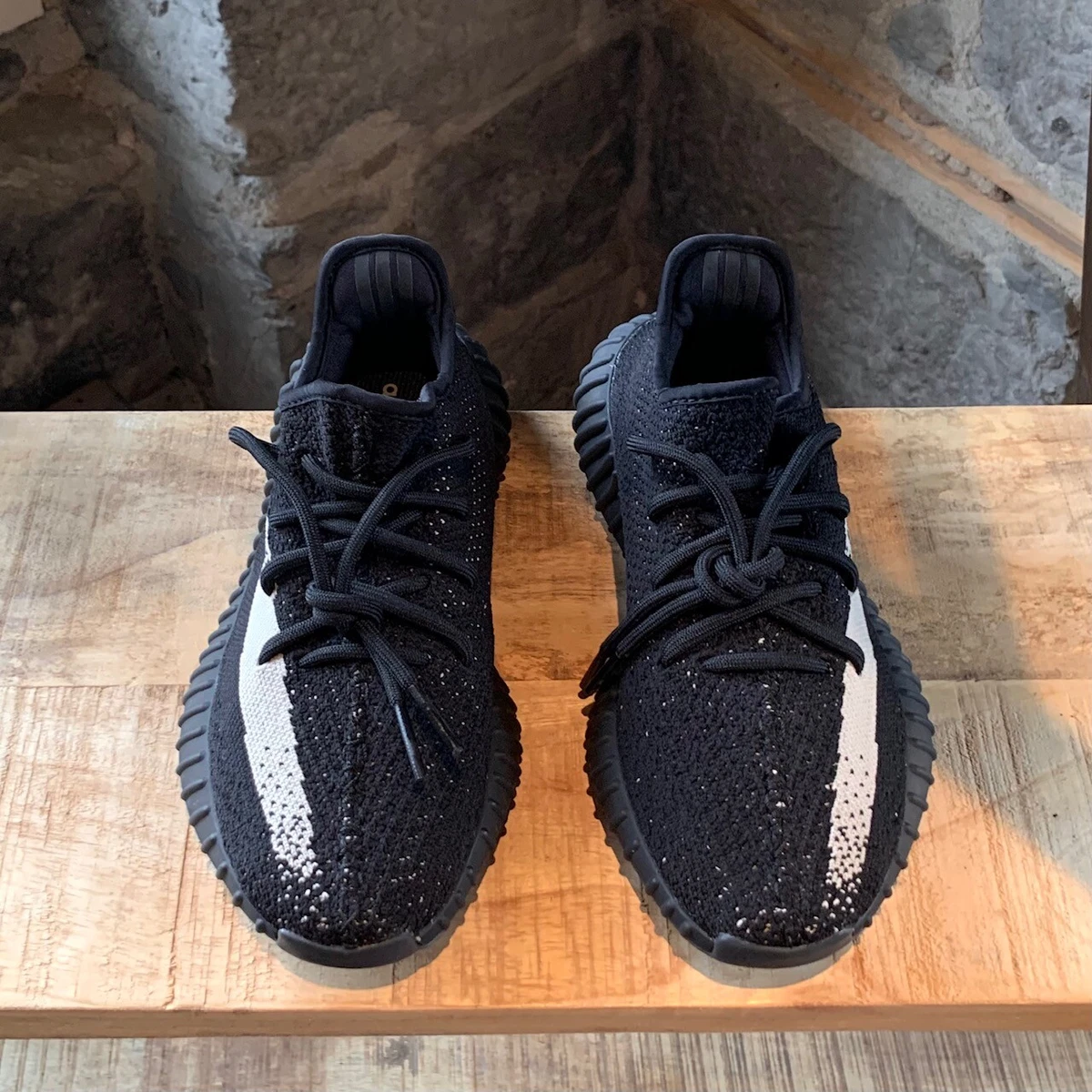Black yeezys with white stripe cheap