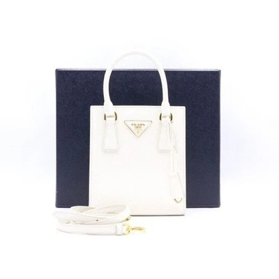 Prada Sac fourre-tout et bandoulière Saffiano blanc avec logo doré 152894472 [U] - Photo 1/4