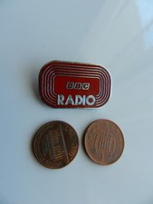 A VINTAGE RARE RED ENAMEL BADGE, BBC RADIO.