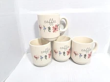 Four Stackable Coffee Cups And Metal Holder