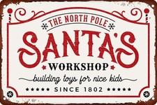 Metal Tin Sign The North Pole Santa  s Workshop Building Toys 8x12