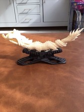 CHINESE DRAGON FIGURINE ON WOODEN CARVED STAND