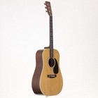 Martin D-28 acoustic guitar with light wood body, dark ebony neck twist, and silver hardware in black case.