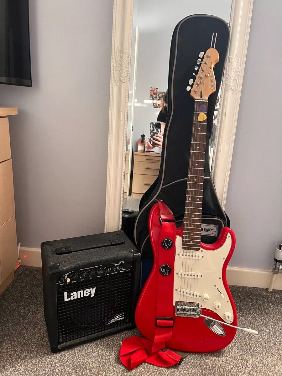 Used Red and white electric guitar and amp in good condition