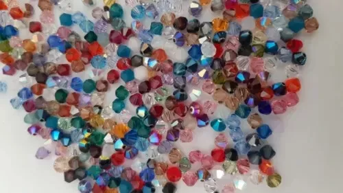 Mezcla de 100 cuentas bicónicas de cristal genuino Swarovski de 6 mm #5301 en colores surtidos - Imagen 2 de 4